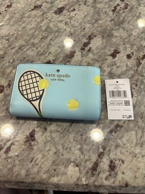 kate spade Grand Slam Racquet Club trifold leather wallet with gold logo